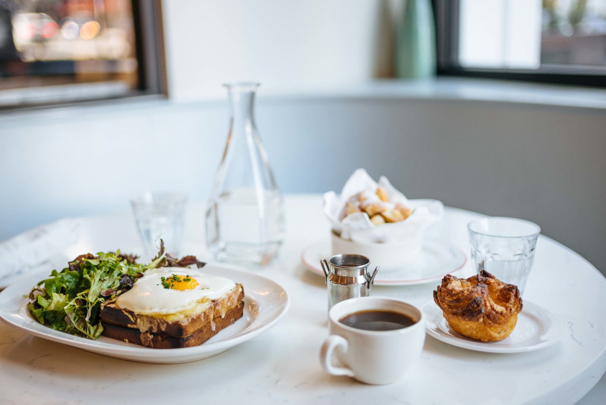 Lunch at Le Politique restaurant in Austin serving Kouign Amman and Croque Madame