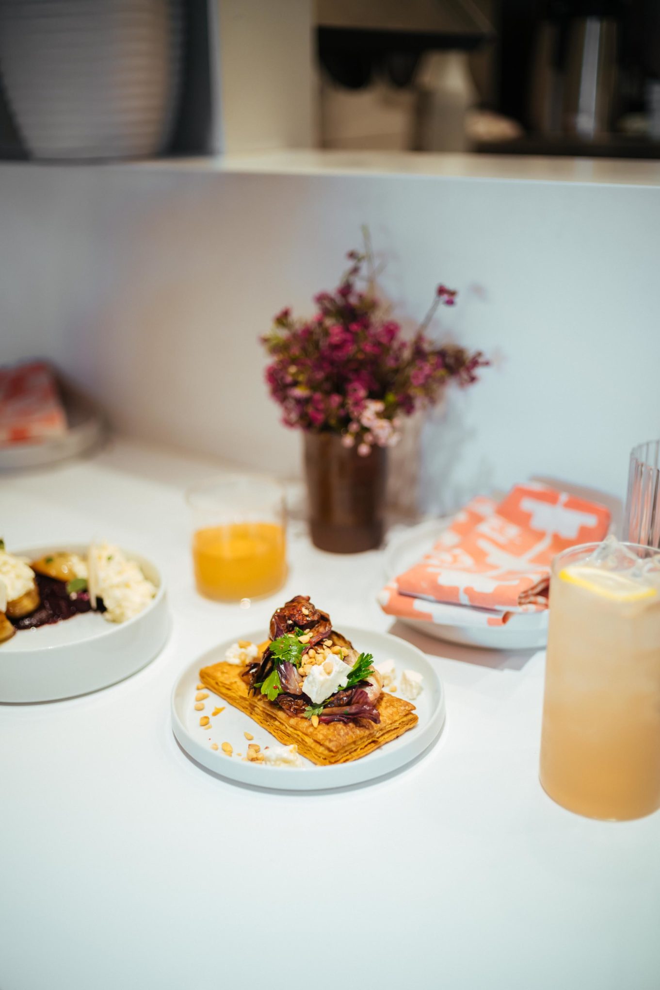The Taste Edit recommends brunch or lunch at Kismet in Los Angeles. The roasted radicchio tart with onion jam, feta, pine nuts, and Aleppo honey is crisp and flaky. 