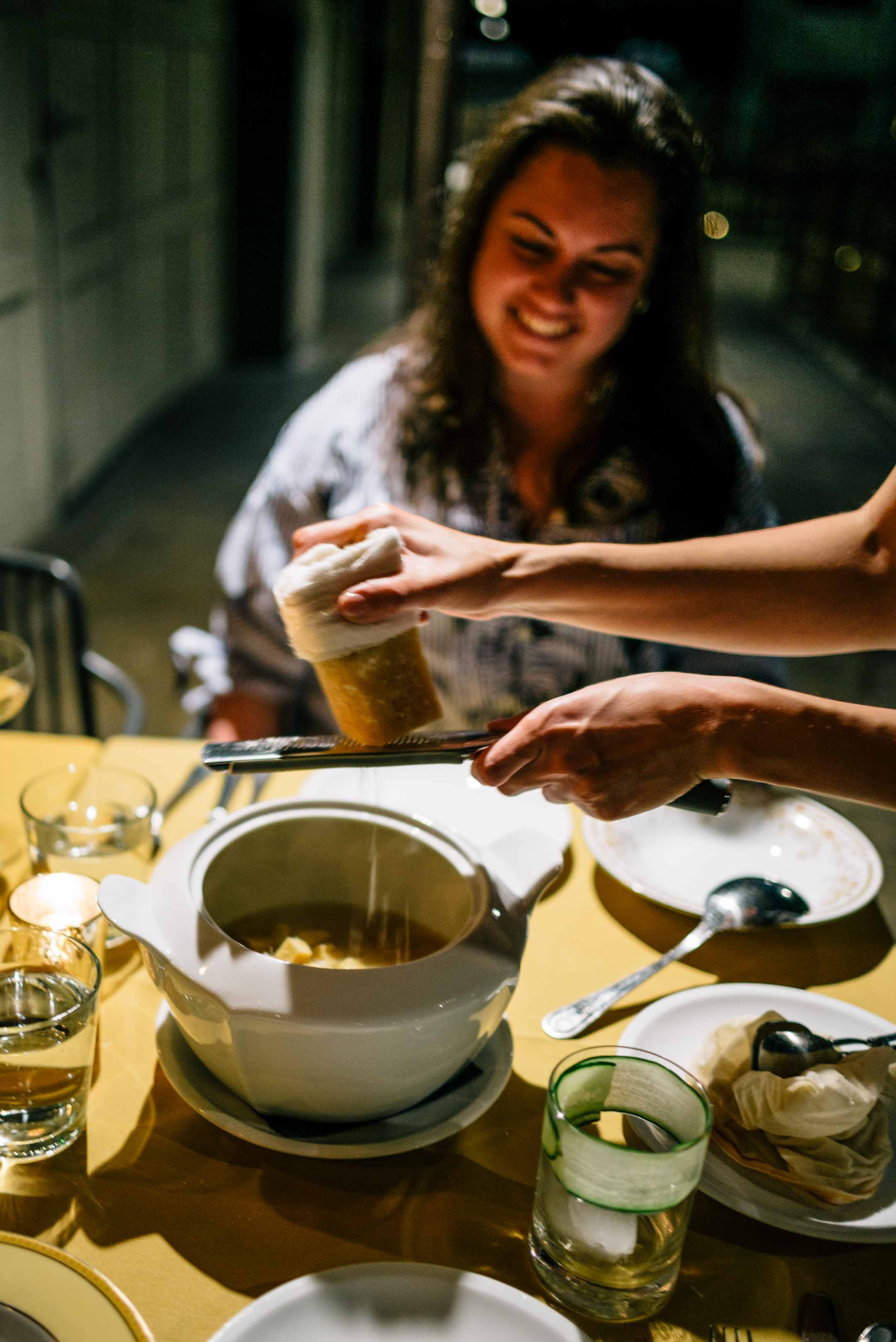 Topping soup with parmesan at Downtown LA restaurant Rossoblu