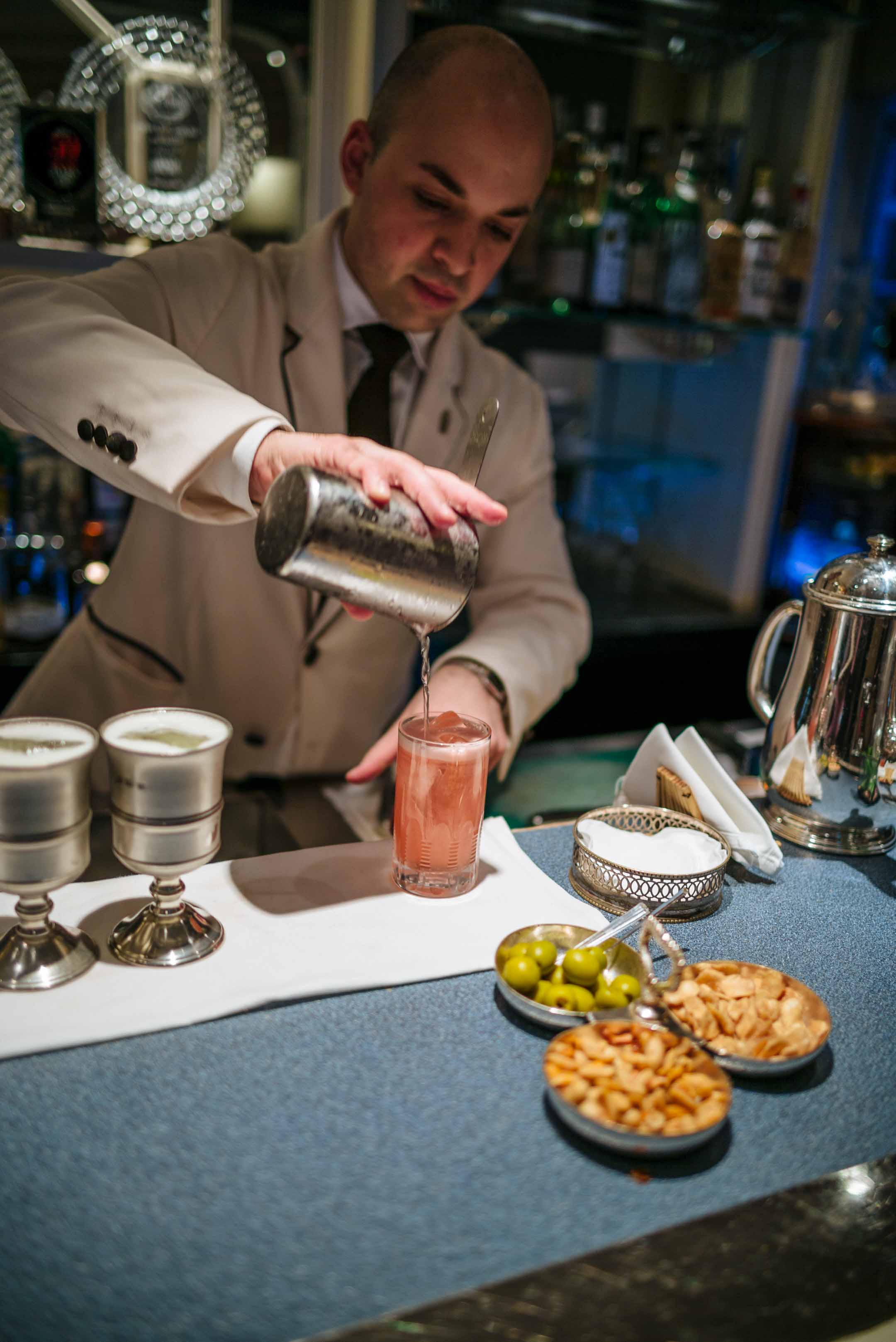 Making cocktails at The American Bar in London at The Savoy Hotel for cocktails