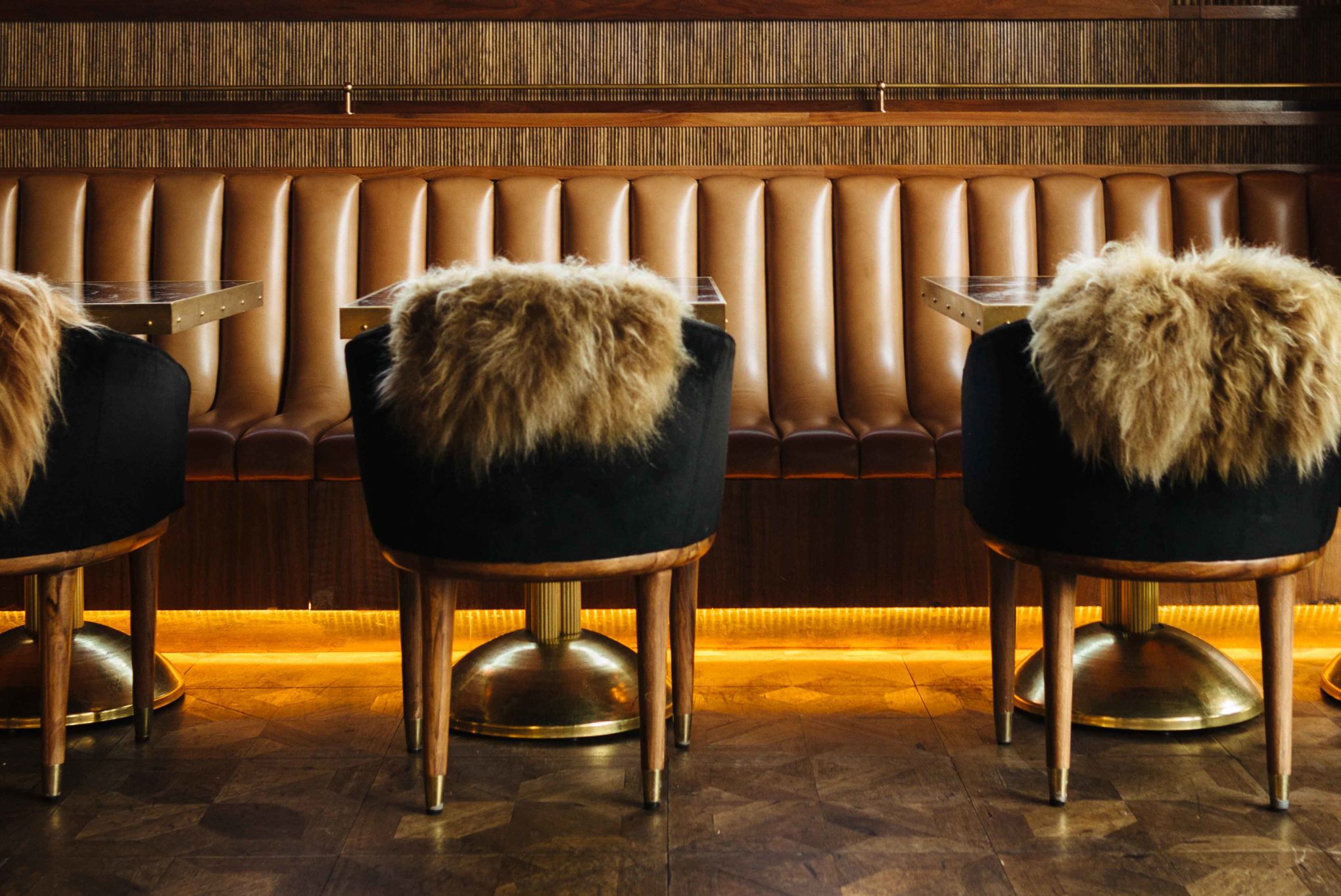 Glamour and old school steak house in San Diego - born and raised, an over-the-top steakhouse decor with dark jewel colors, flowers, fur throws, and gold