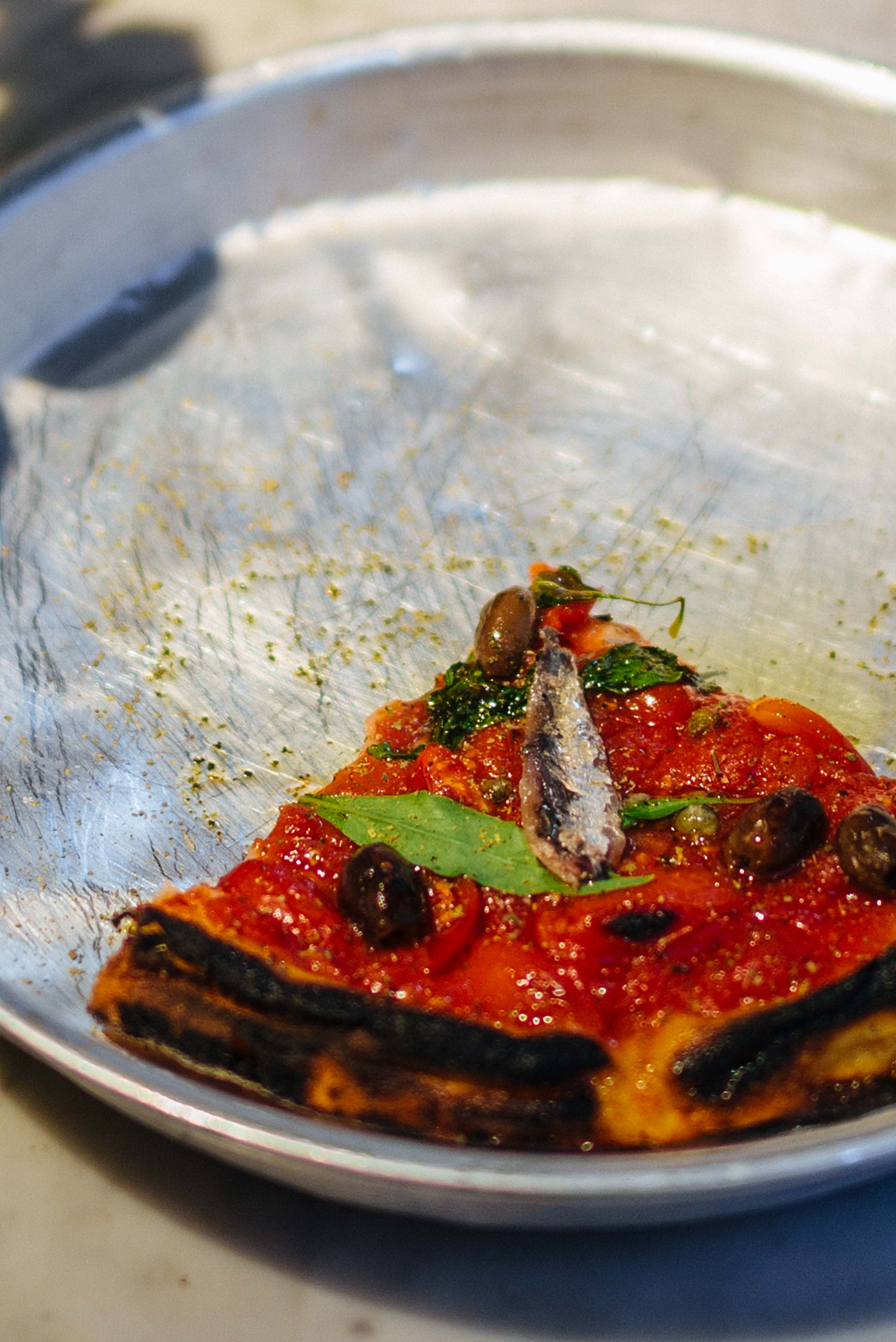 The best deep dish pizza with olives and anchovies. You'll find it in Napoli, plus they even have fried pizza! It's the best vacation destination for foodies. #food #pizza #italy #napoli