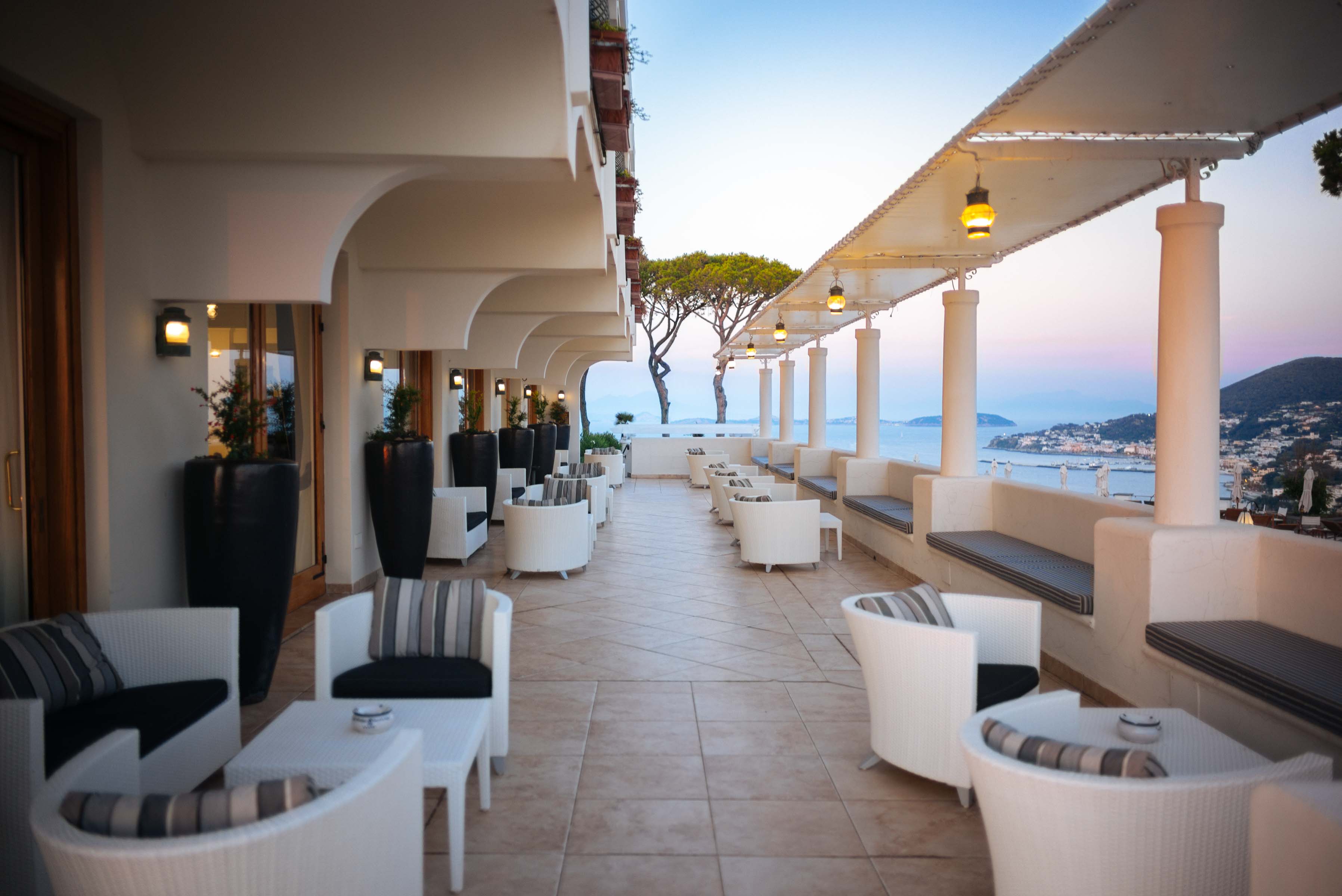 San Montano in Ischia, Italy has a long patio with a view of the bay, perfect for cocktails before dinner | thetasteedit.com #italy #travel #hotel