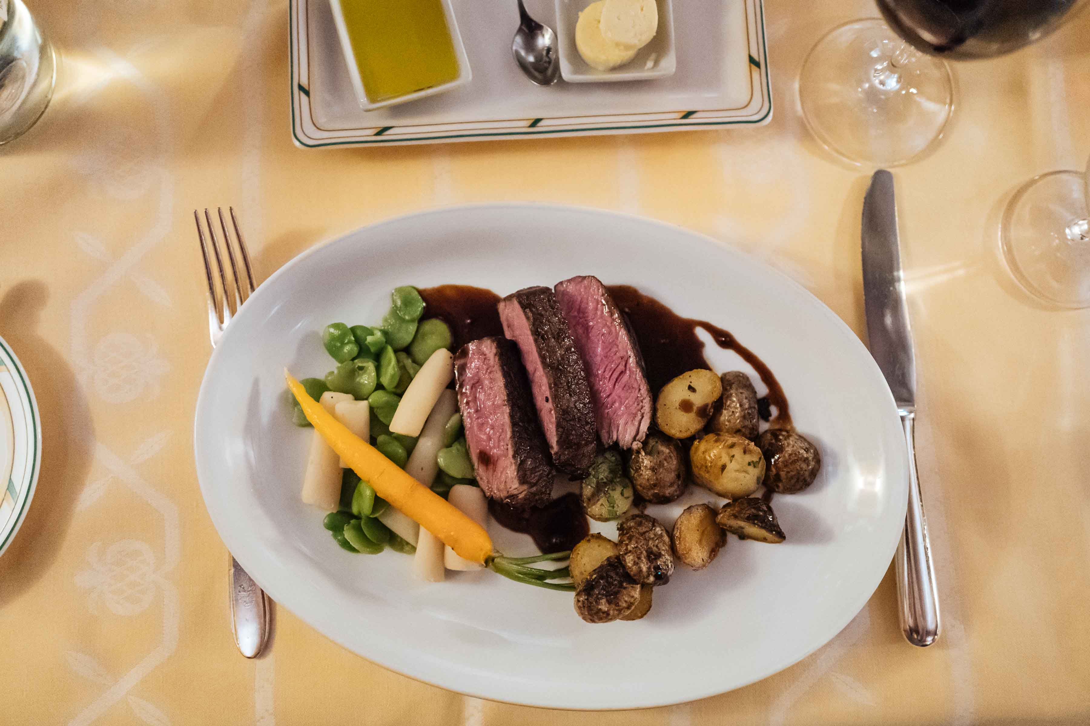 Dine at the historic restaurant chesa grischuna Klosters Hotel near Davos offering steak, turbot, soup, and game dishes | The Taste Edit #travel #switzerland #swiss #restaurant #food