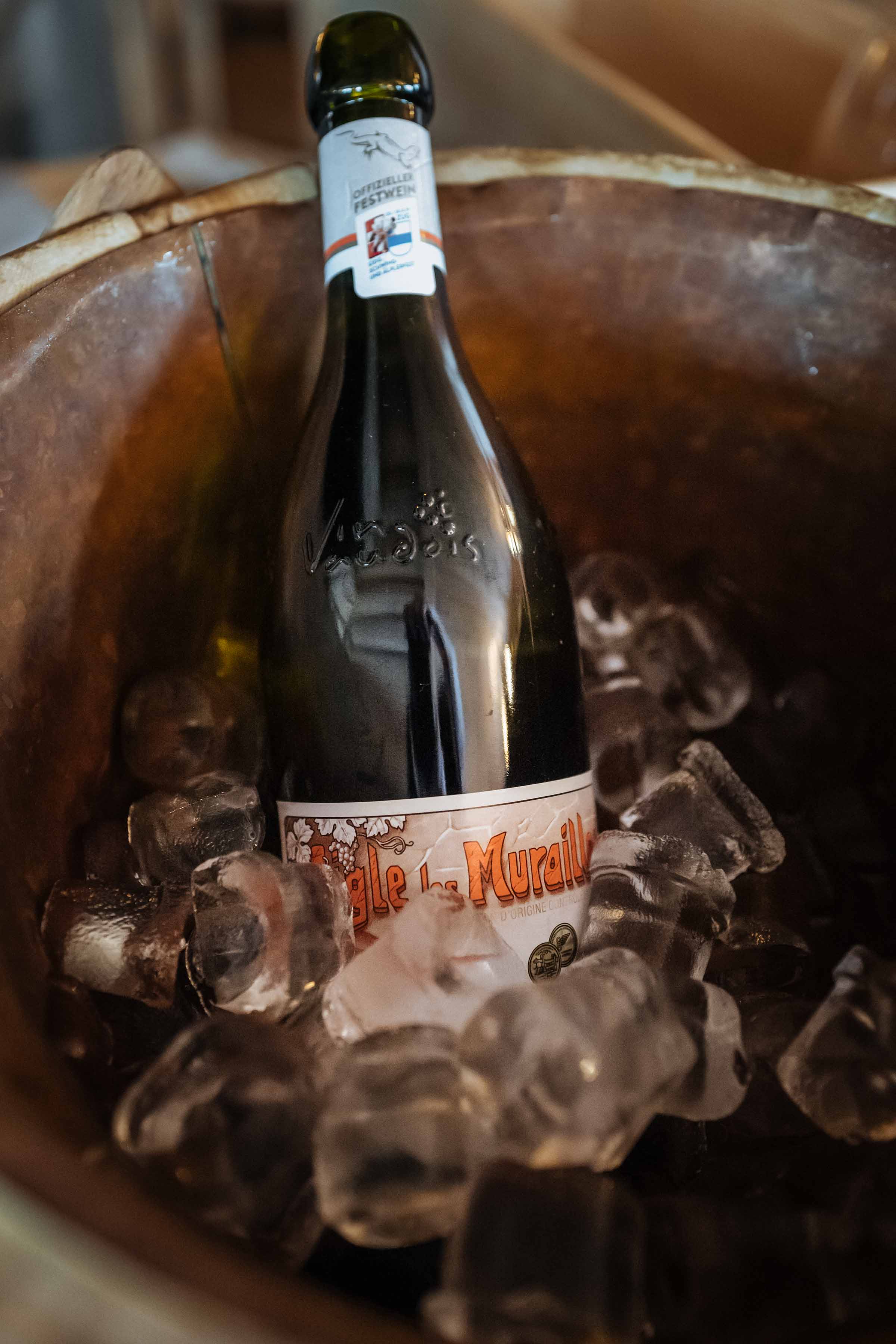 Delicious Swiss Natural wine is served at Klosters Restaurant Hohwald with fondue for two