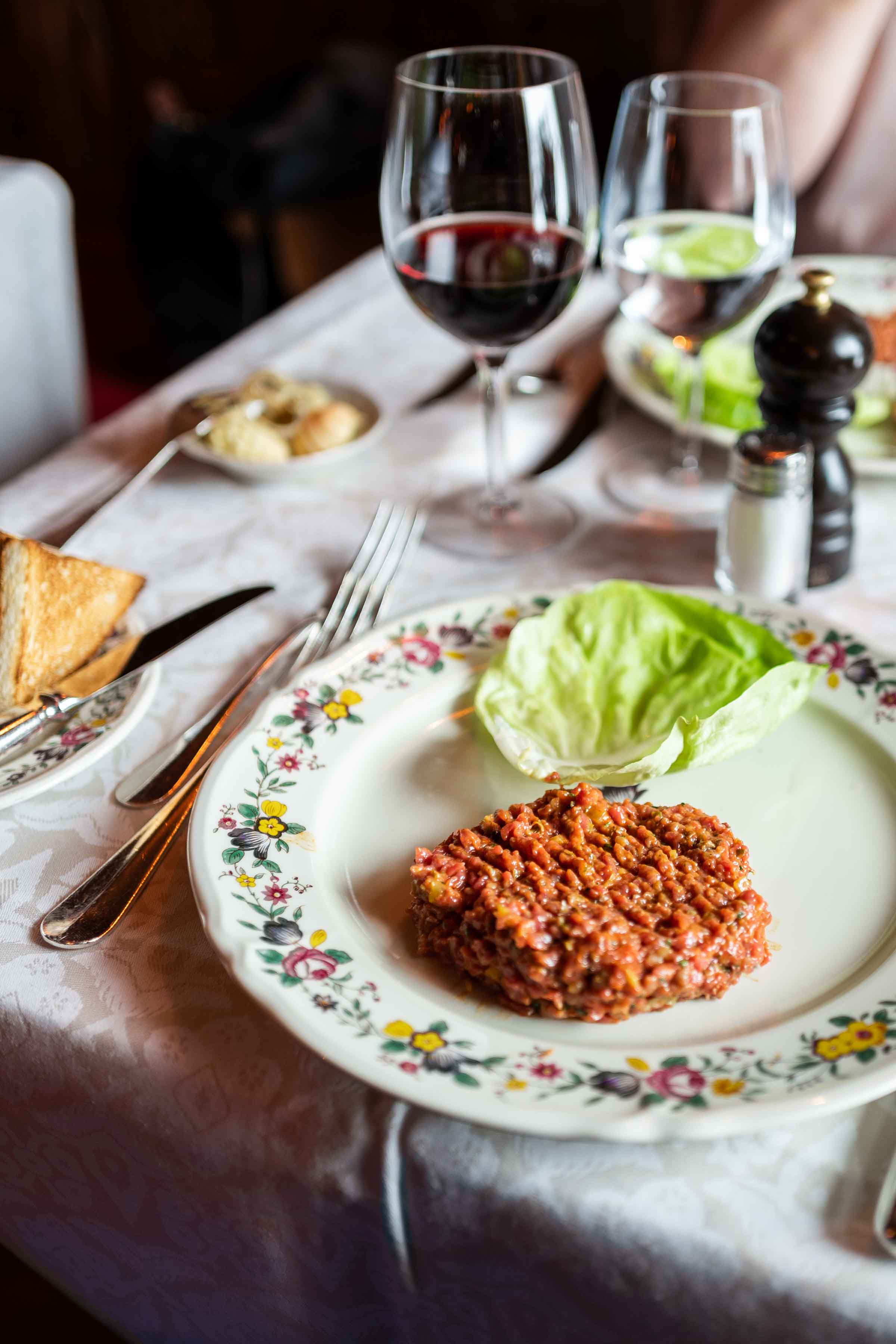 Request the table side steak tartar at this famous St Moritz restaurant customized with cognac, horseradish, and more | thetasteedit.com #travel #switzerland #stmoritz #beef