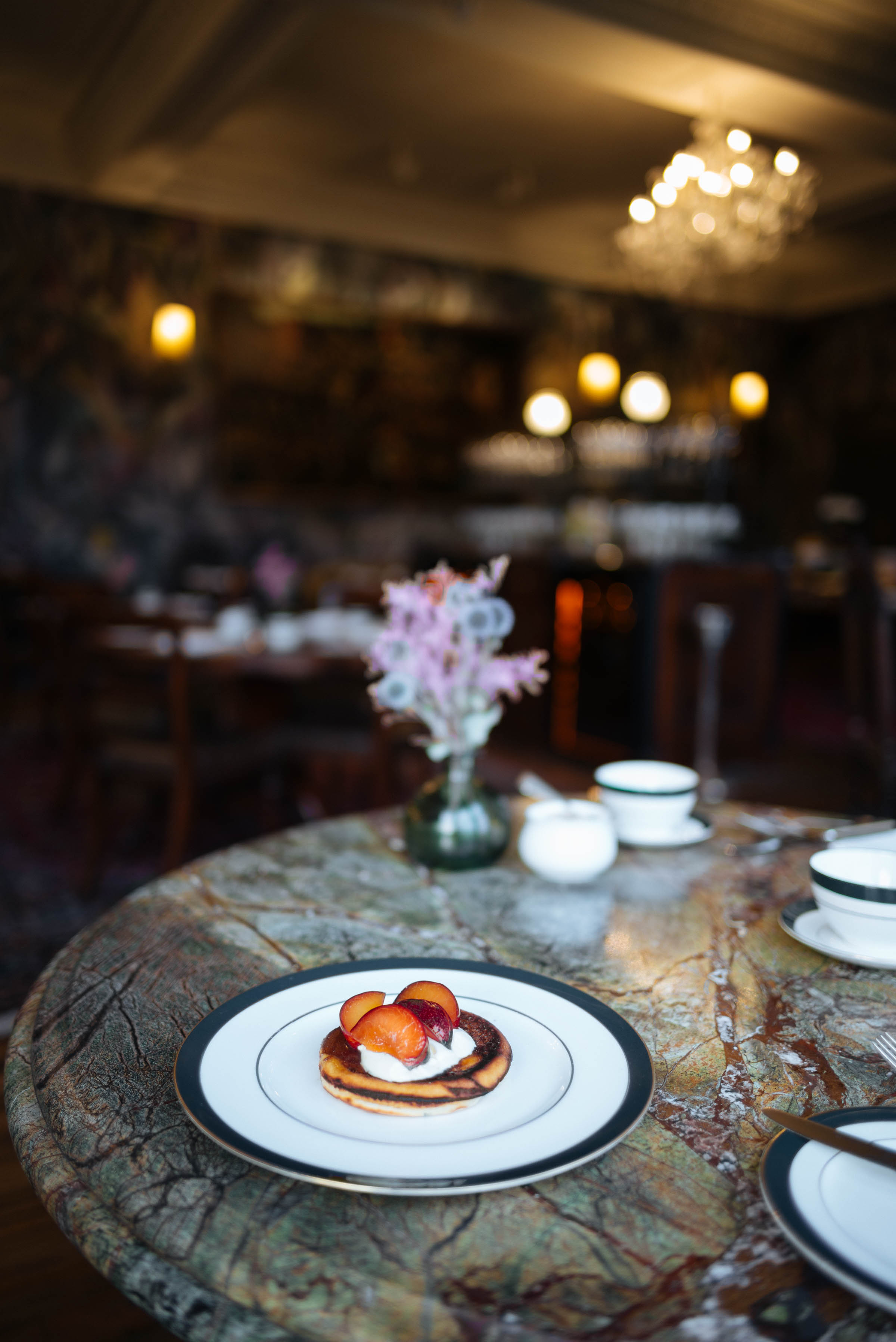 The best drop scones in Scotland for breakfast come from The Fife Arms in Braemar. Now you can make them at home with an easy drop scone recipe serve with whipped cream and fresh fruit.