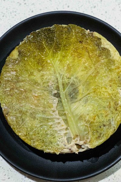A Chou Farci is a simple French Stuffed Cabbage Recipe filled with layers of beef or pork, carrots, mirepoix, and rice or lentils. You can even make a vegetarian version. | thetasteedit.com #recipe #cabbage #French