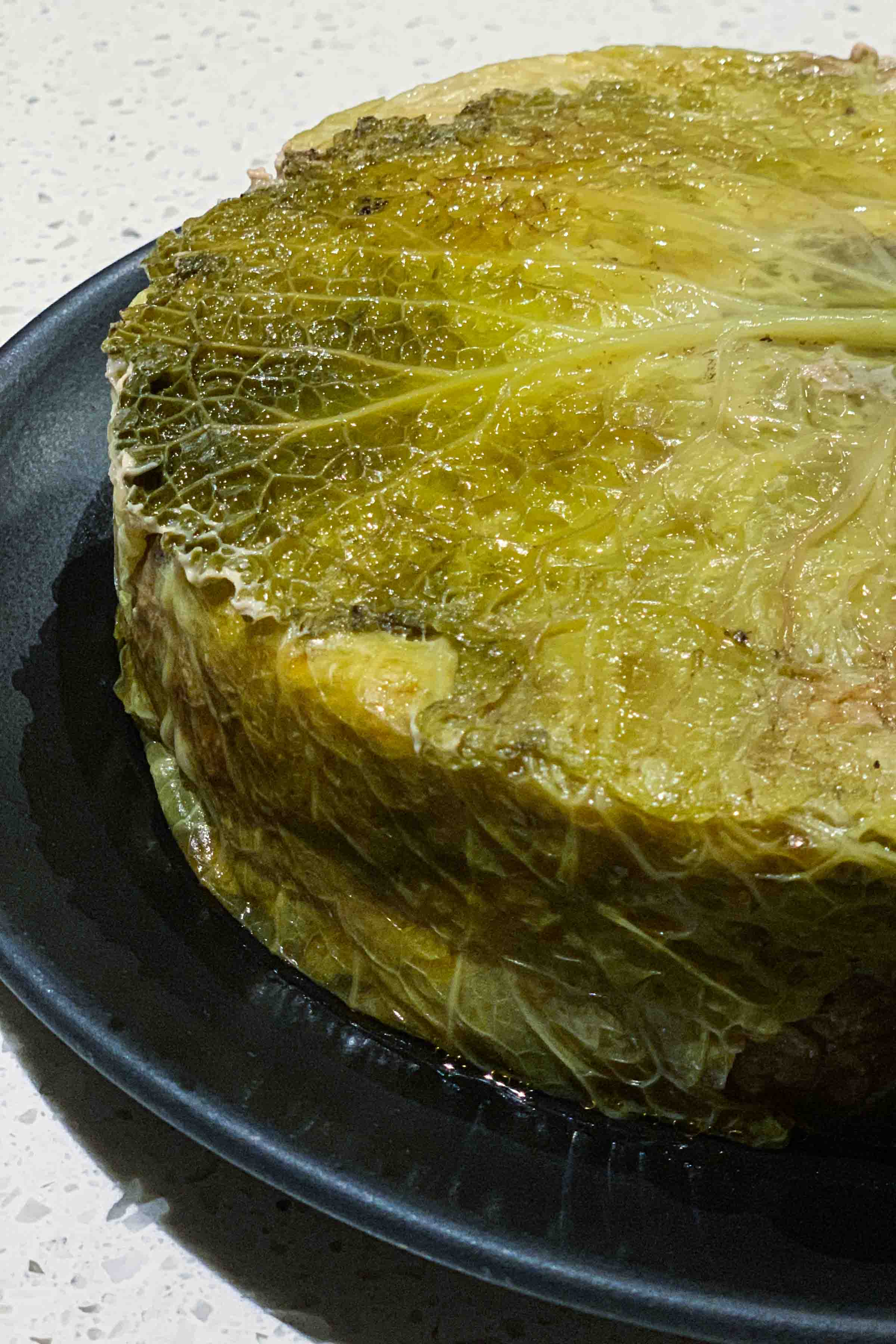 Make a French whole Stuffed Cabbage Cake called a Chou Farci. Cut a slice for lunch or dinner. | thetasteedit.com #recipe #cabbage #French