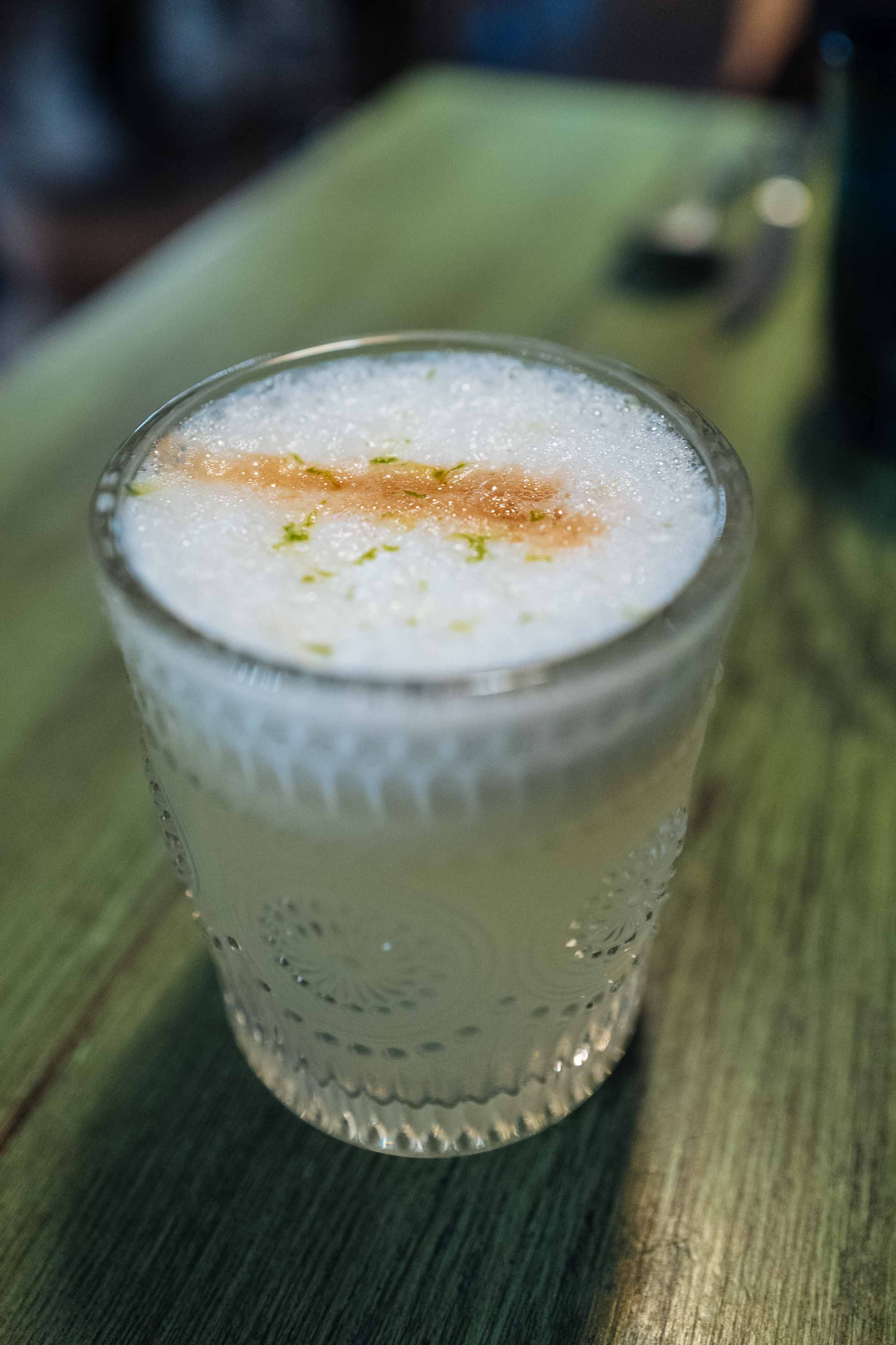 Started your dinner at Yakumanka with freshly mixed Pisco sours while you the menu, which featured a variety of fish and seafood options. | thetasteedit.com #geneva #food #switzerland