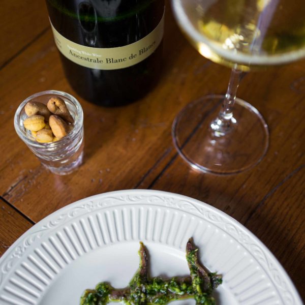 Make simple salsa verde anchovies with parsley, garlic, and olive oil to pair with your sparkling wine. | thetasteedit.com #recipe #appetizer #italian #wine