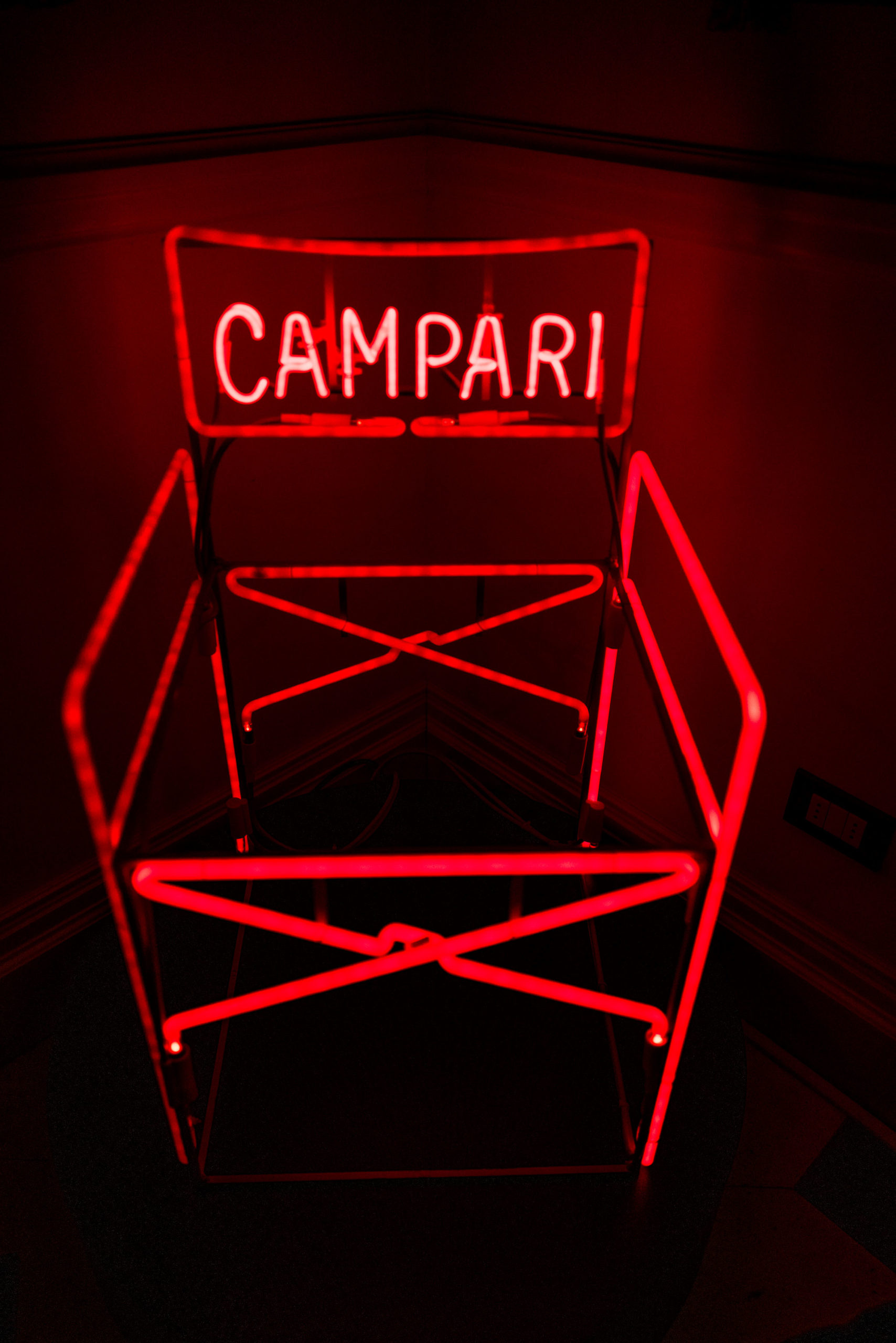 Neon Campari chair at the bar in Rocco Forte's Hotel de la Ville Rome - The Taste Edit #rome #hotel #decor #travel #campari