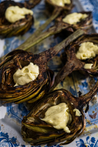 Fill the cups of grilled artichokes for dipping. It's perfect for parties, The Taste Edit #artichokes #recipes #grilling
