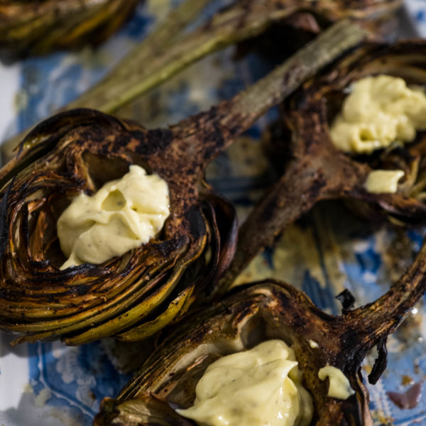 Fill the cups of grilled artichokes for dipping. It's perfect for parties, The Taste Edit #artichokes #recipes #grilling