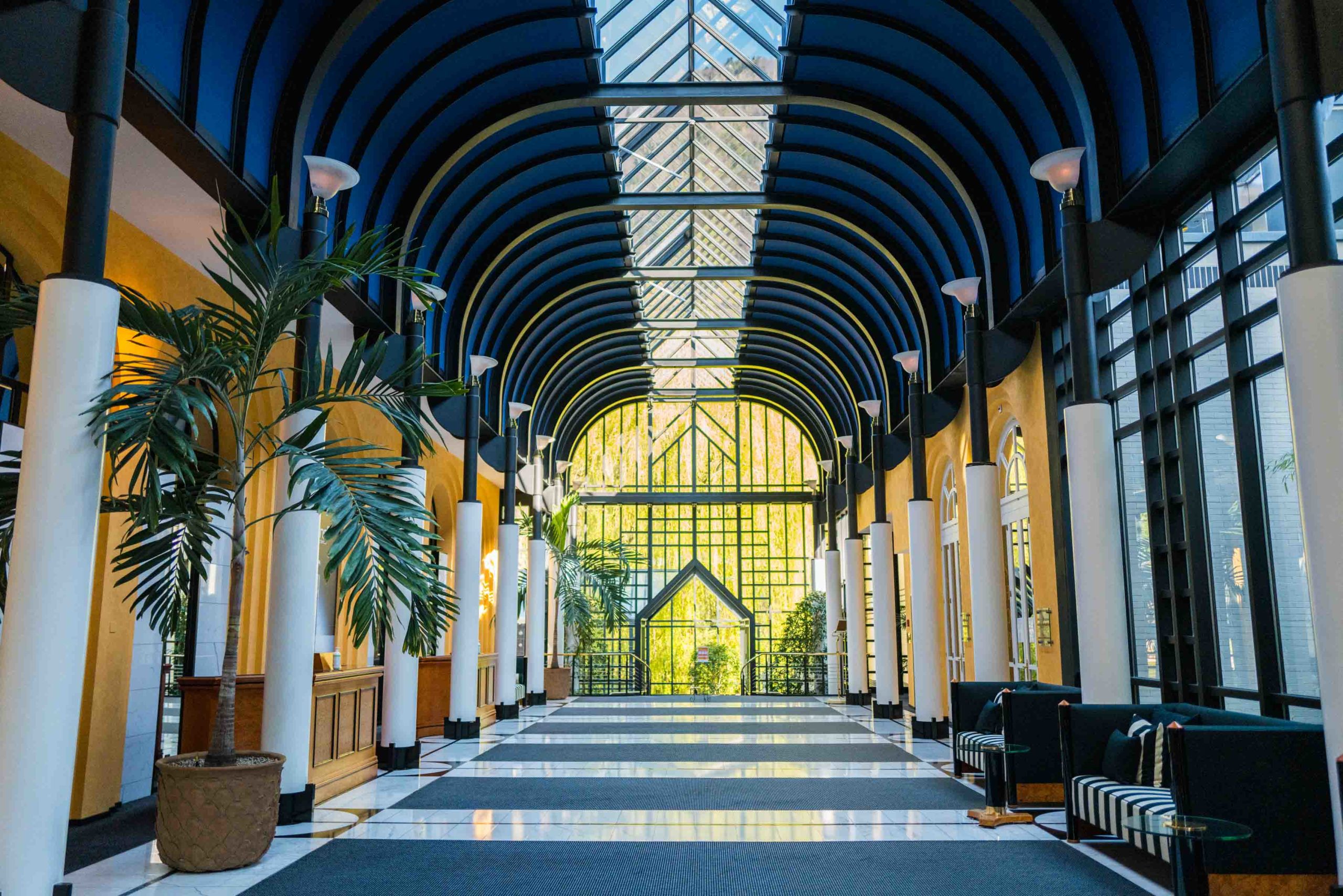 The hotel is renovated and now has a majestic palm-lined glass lobby joining the two historic buildings. #interlaken #jungfrau #swiss #hotel