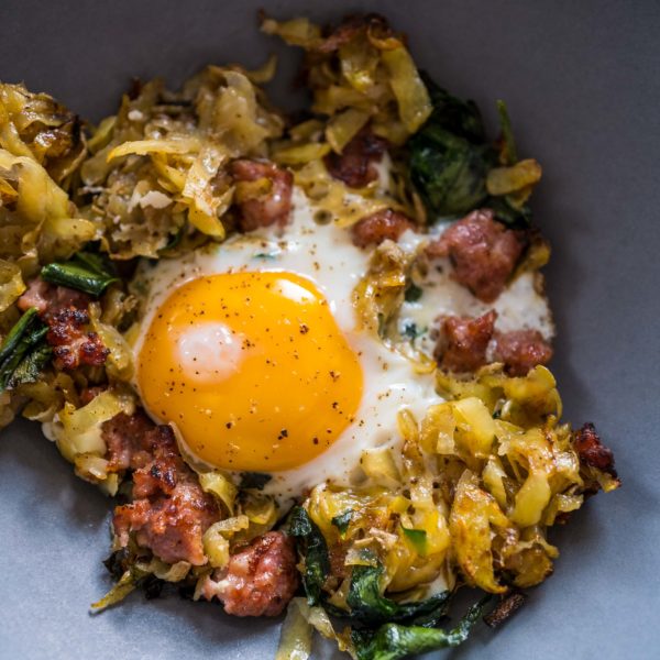 Make the best homemade hash browns recipe with crumbled sausage and ramps for breakfast this weekend. You can use wild garlic or kale if you don't have ramps. #recipe #breakfast #easy