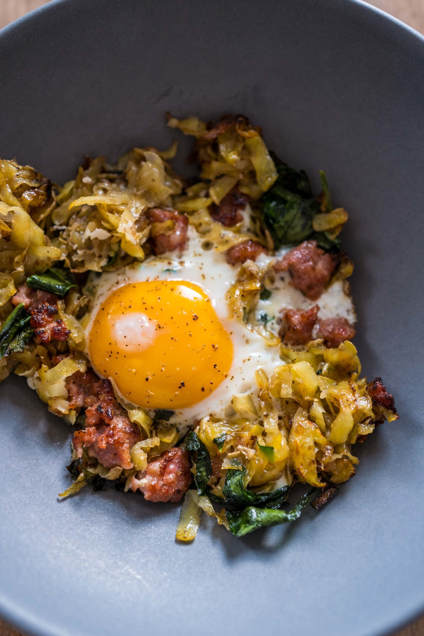 Make the best homemade hash browns recipe with crumbled sausage and ramps for breakfast this weekend. You can use wild garlic or kale if you don't have ramps. #recipe #breakfast #easy