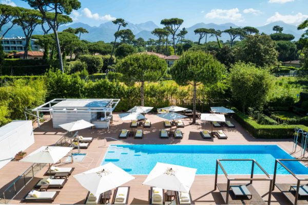 Where to stay in Forte dei marmi italy? Go to Principe Forte dei Marmi Hotel with a beach club and fantastic pool with a mountain backdrop