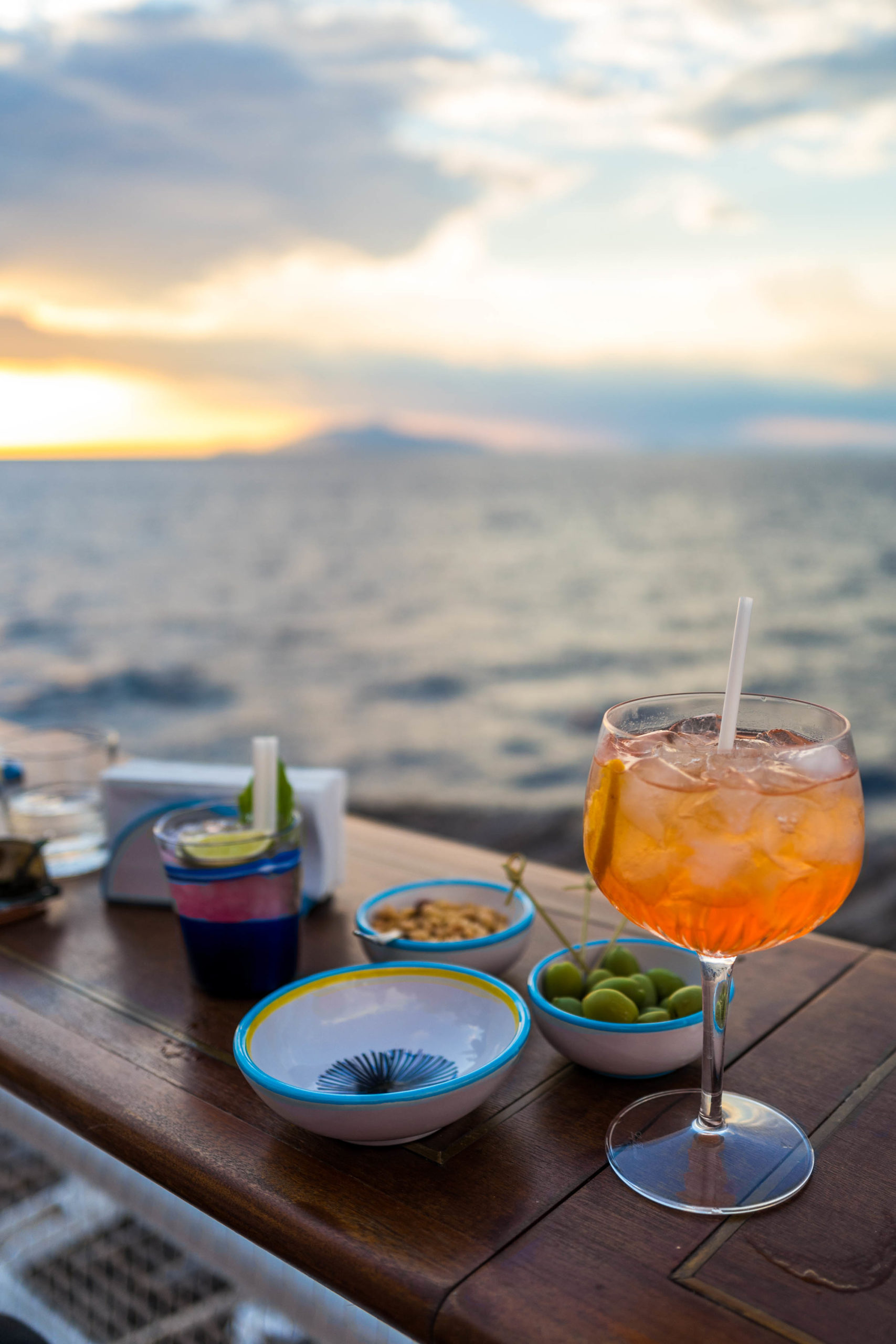 Watch the sunset with cocktails or aperitivo at the Dior Popup at Il Riccio in Capri