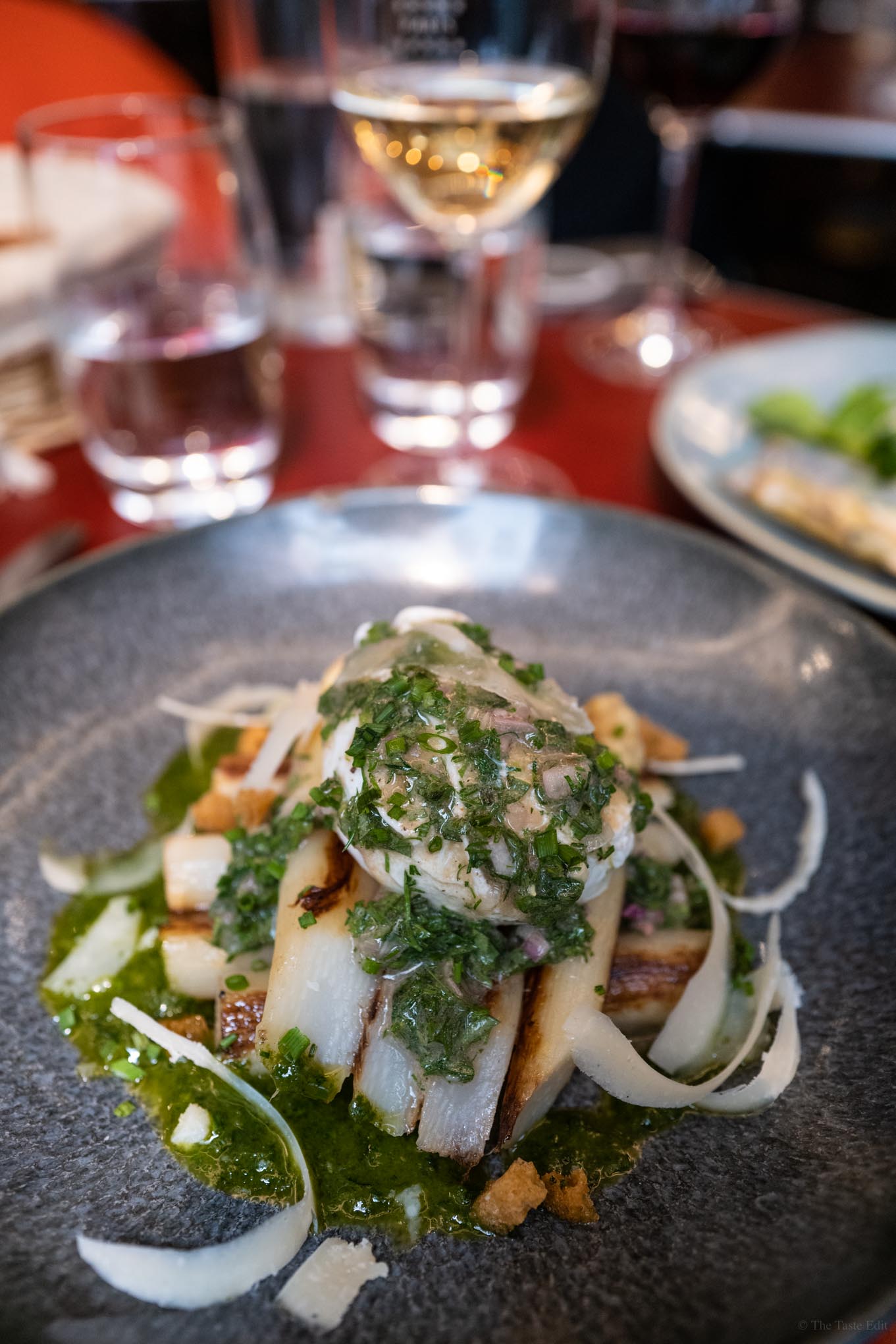 Seasonal dishes are served at Juveniles in Paris like this white asparagus and egg appetizer