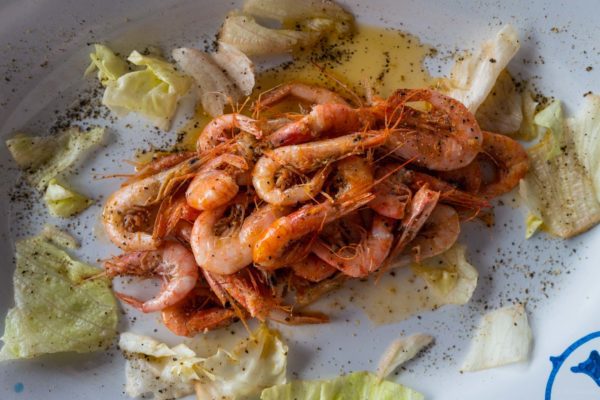 Order the salt and pepper shrimp at La Tonnarella beach club restaurant near Amalfi, one of Jackie Kennedy's favorite restaurants in the Amalfi Coast