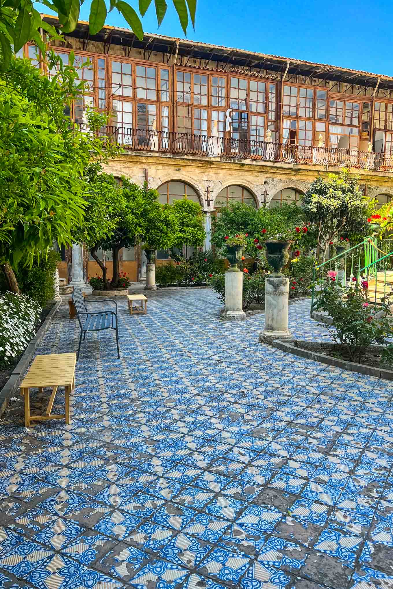 Eat canolli atI Segreti del Chiostro in the beautiful blue tiled courtyard of the church