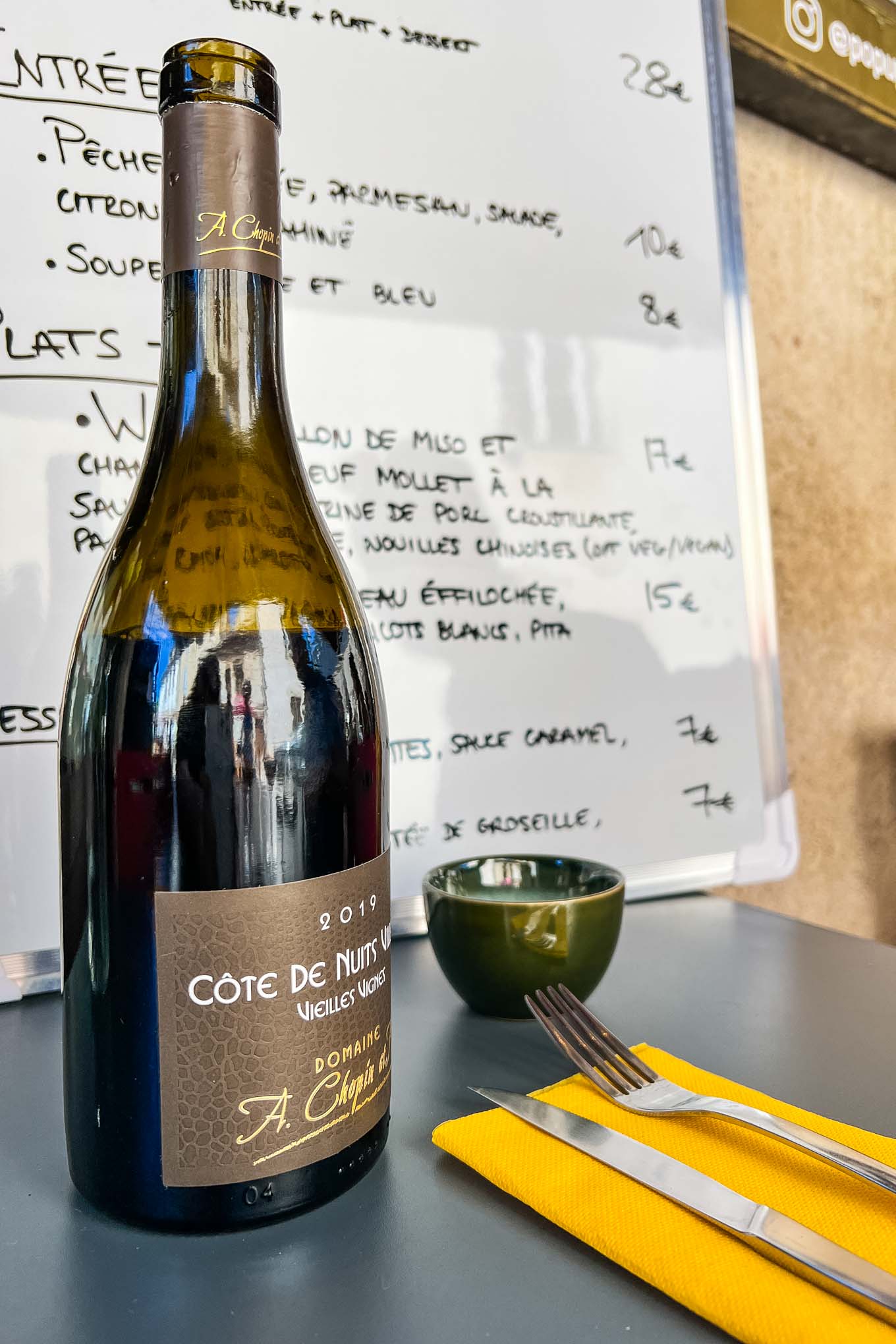 Local wines are served at Fresh and seasonal dishes at Pop Up Upper Restaurant in Beaune France Summer 2022