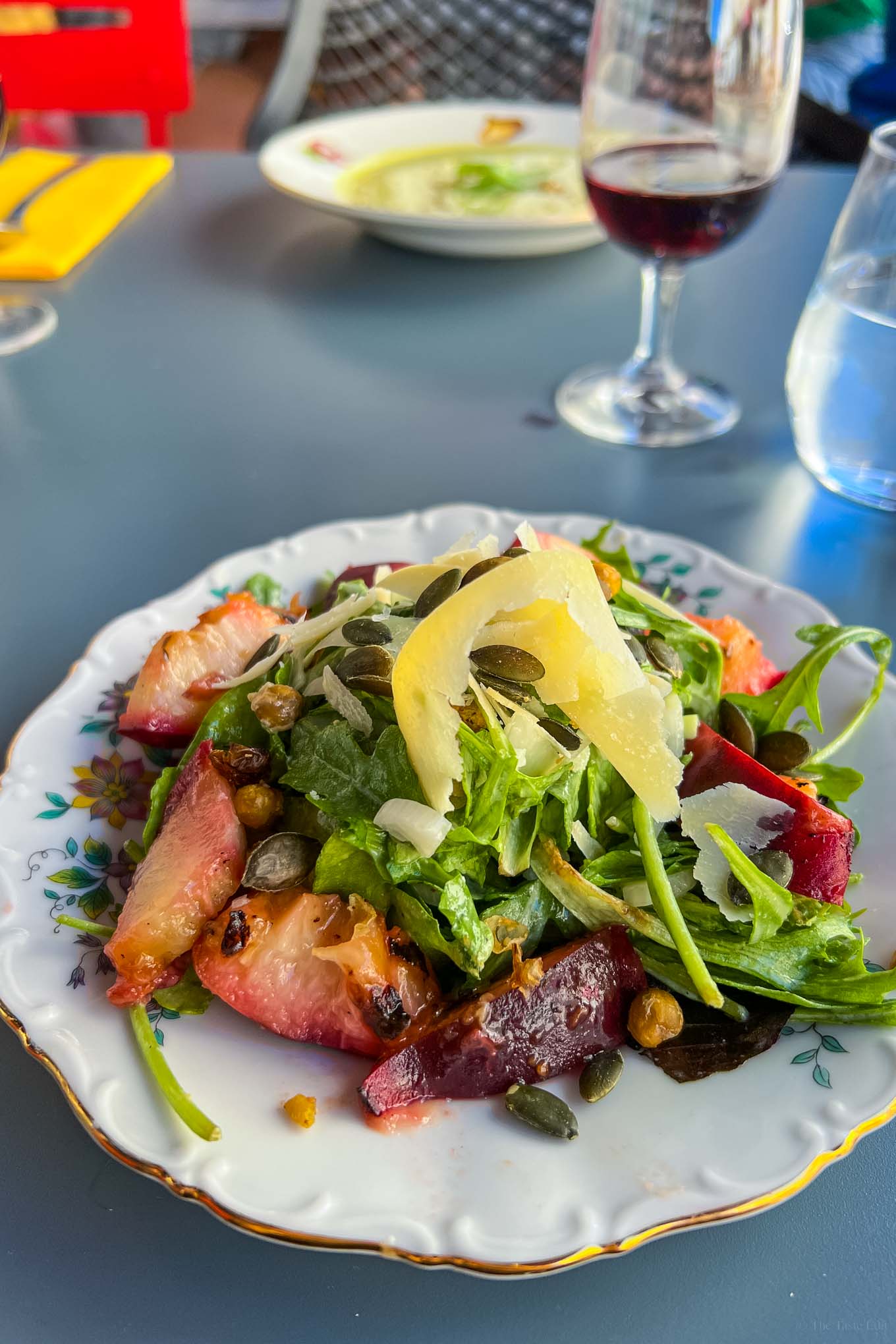 Fresh and seasonal salad with peaches and parmesan at Pop Up Upper Restaurant in Beaune France Summer 2022