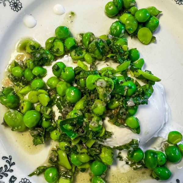 Make an easy pea and burrata salad with minced cilantro and mint served with crusty bread for lunch or a vegetarian dinner
