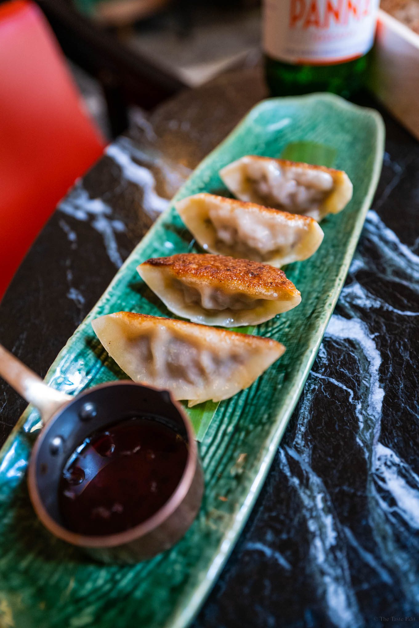 Delicious and flavorful Kobe beef gyoza appetizer at Beefbar Milan restaurant, with perfectly crispy and golden brown outer shells and savory, juicy fillings.