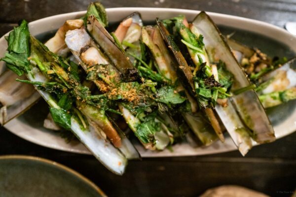 Grilled Razor clams with herbs served at Hestia in the south of france at a natural wine restaurant