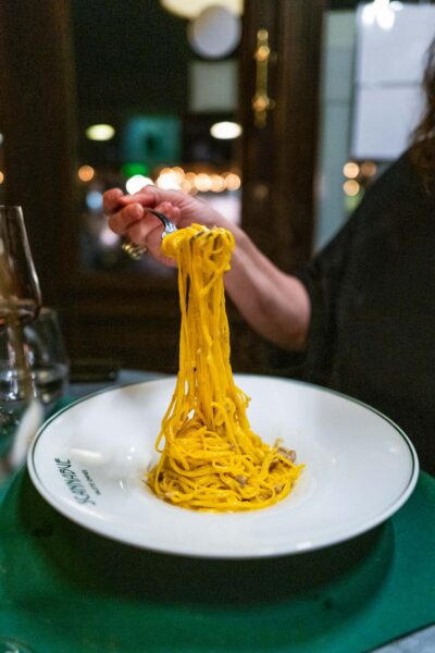 twirling pasta at scannabue caffe restaurant in torino