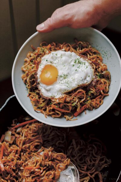 Yakisoba fried noodles made with ramen noodles and topped with a fried egg from Emiko Davis's new Japanese Gohen Cookbook