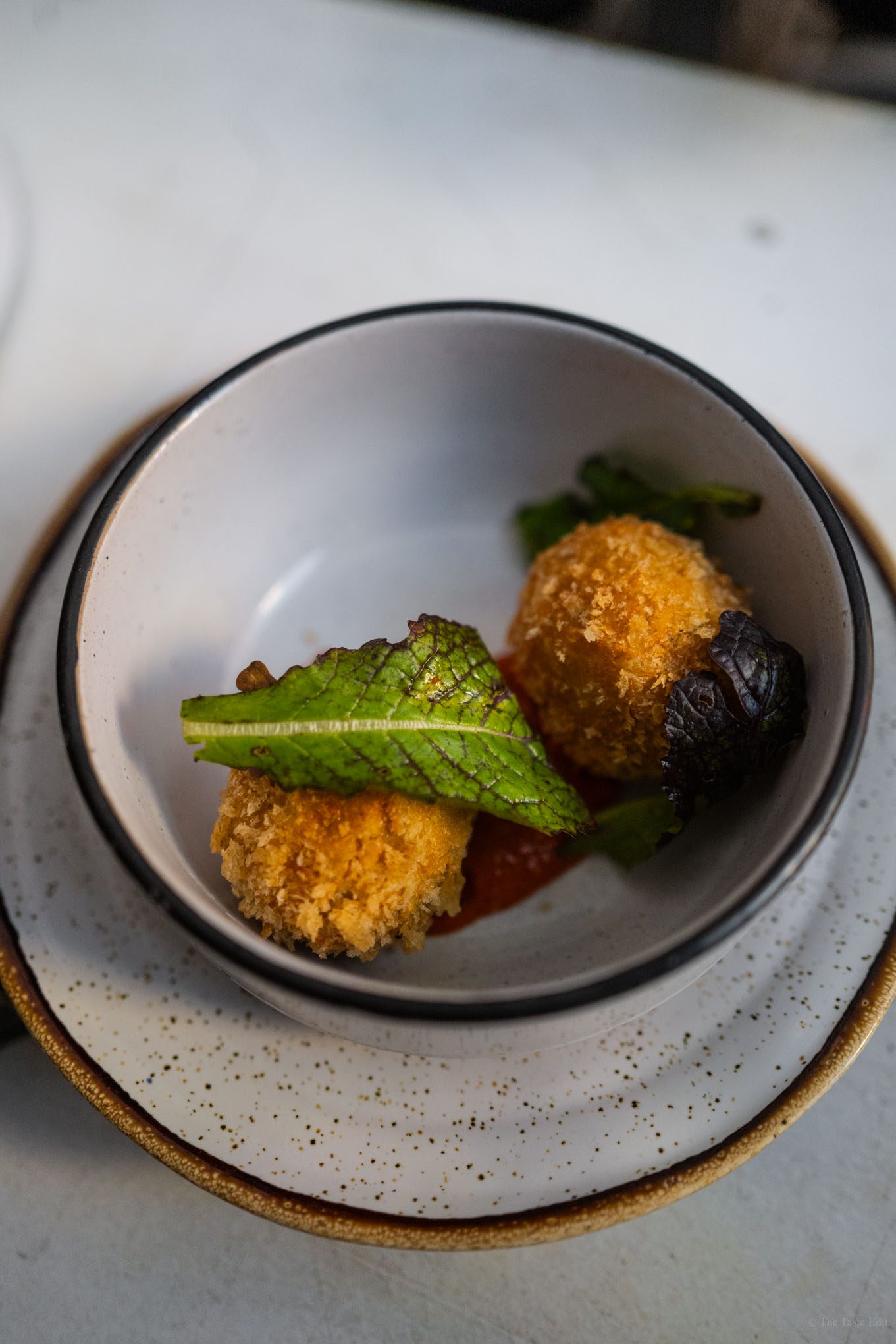 Les Enfants du Marché serves a seasonal menu like these crispy croquettes in Paris