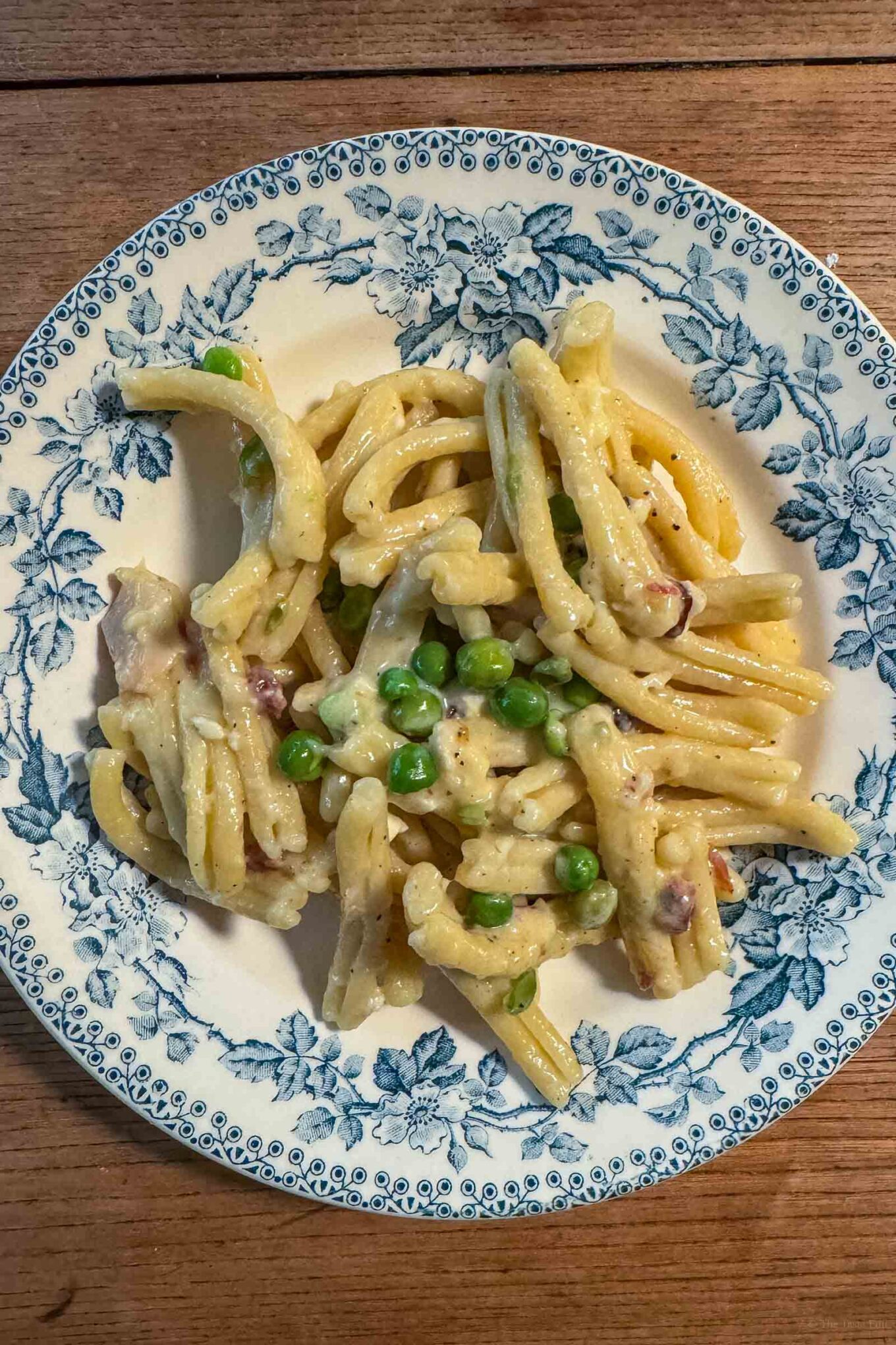 Add some peas for extra vegetables to the pasta with mont d'or cheese