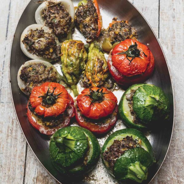 Petit Farcis from Nice a summer dish made with tomatoes, onions, and zucchini in an oval pan