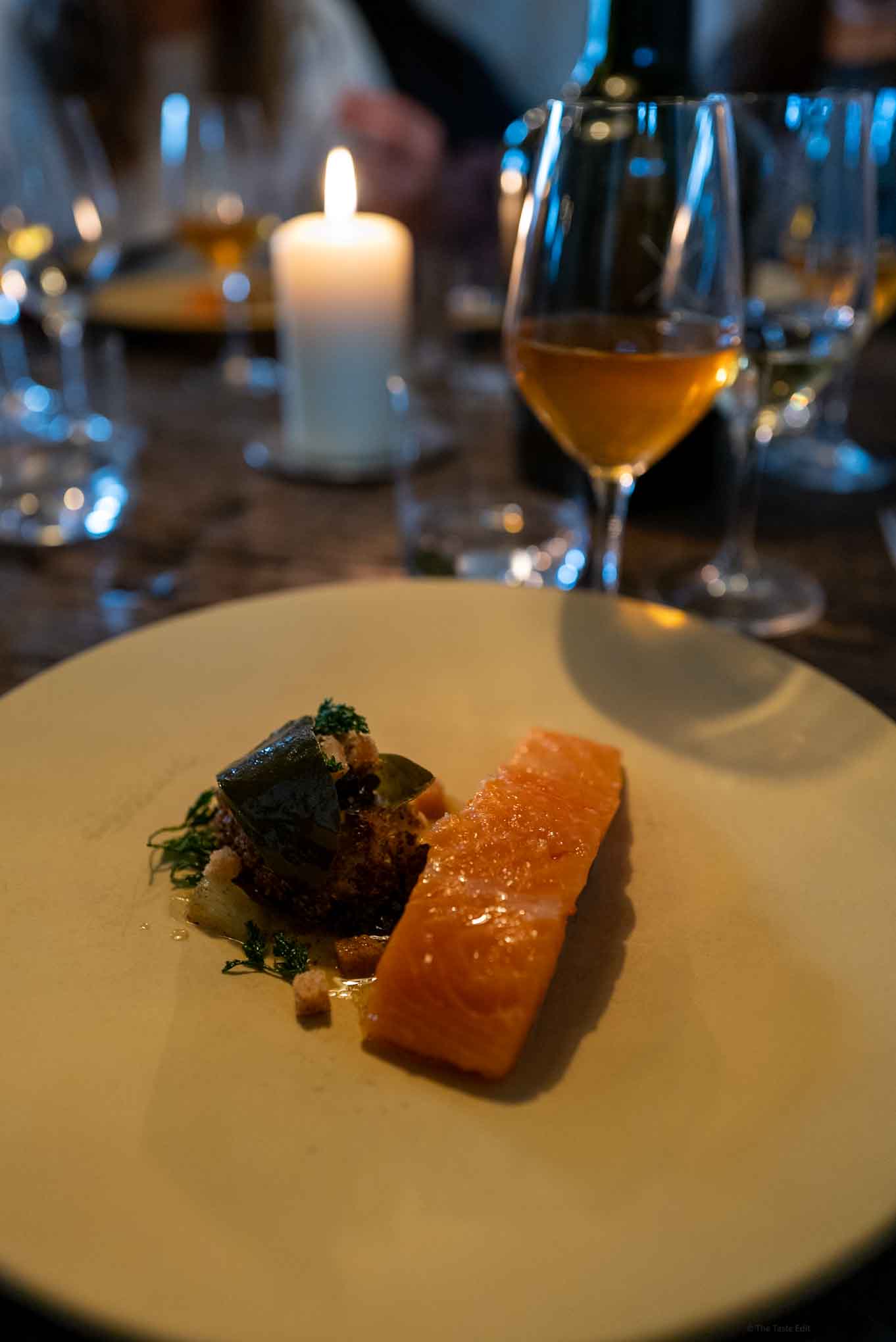 Septime Restaurant in Paris serves butter poaches trout with natural wine by candle light