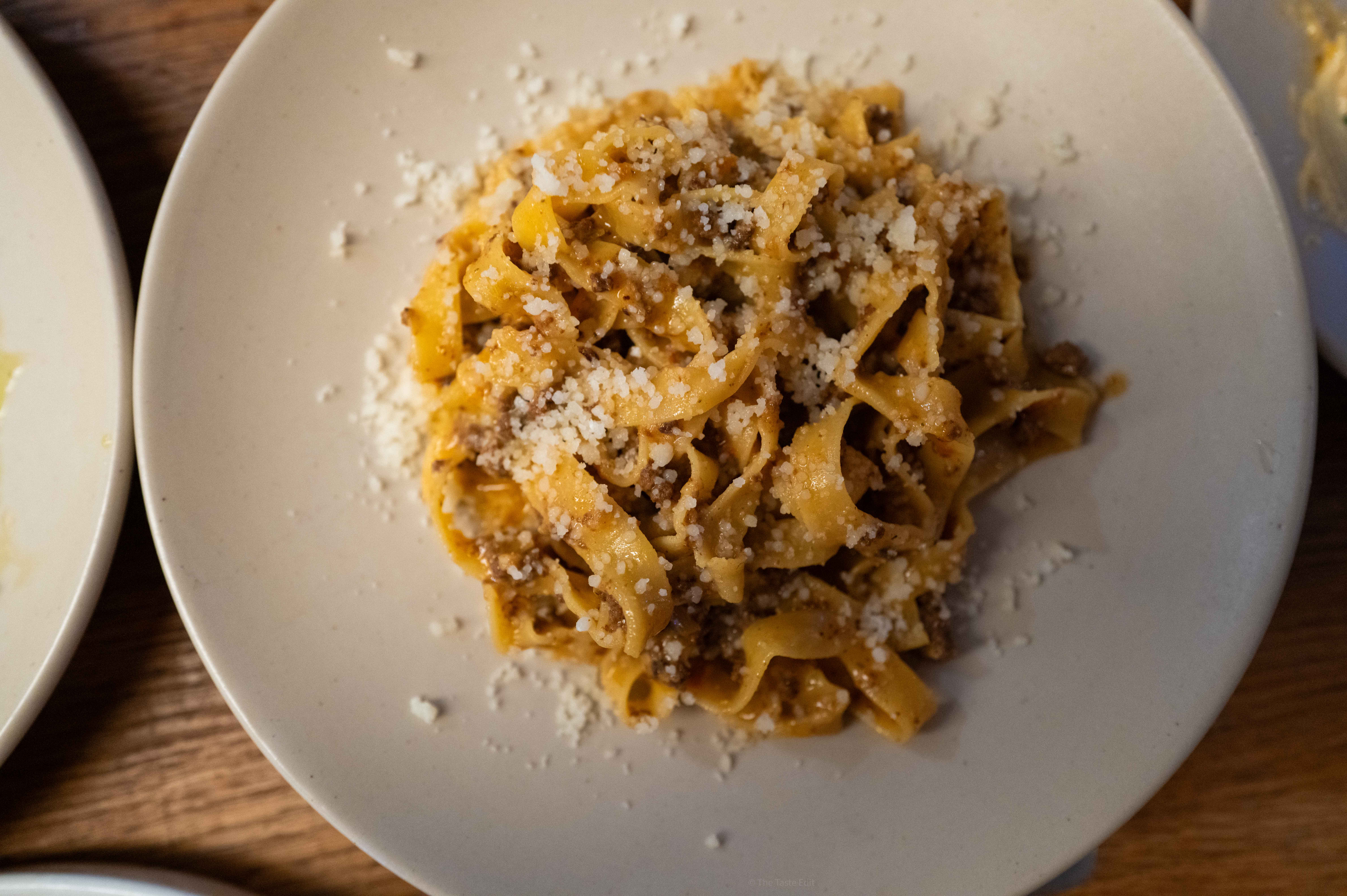 Bolognese pasta at manetaca London’s top Italian restaurant on a white plate