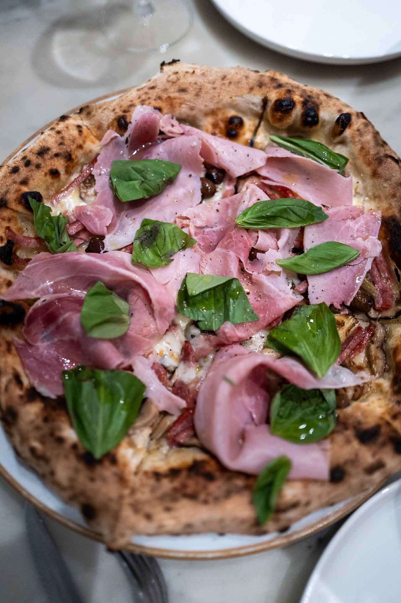 Napoli on the Road Pizza with ham served in Chiswick near London
