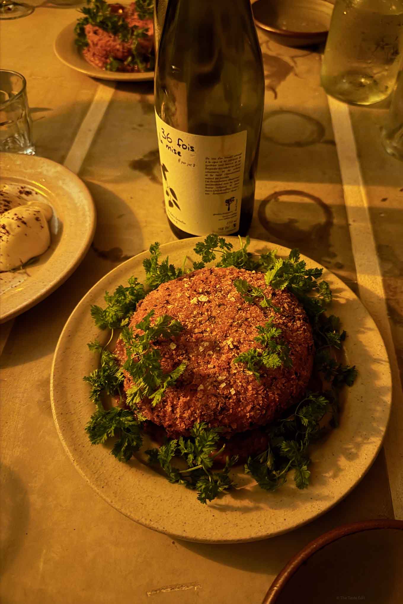 Fried mont d’or cheese at the stables wine under the arches with natural wines topped with chervil and peppers