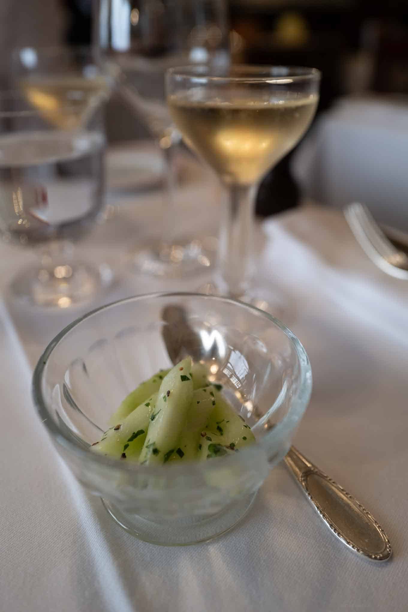 Elegant melon and herb appetizer served at Restaurant Allard, highlighting refined French cuisine.