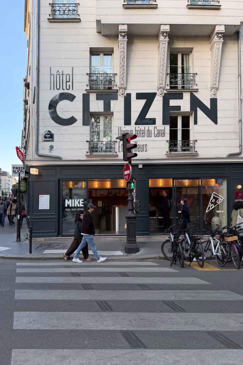 Modern hotel facade with "hôtel CITIZEN" signage in Paris, France.