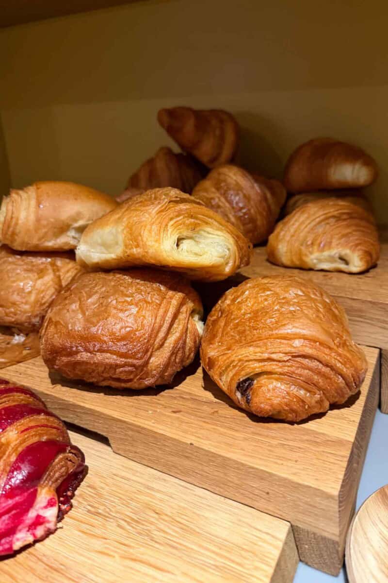 Delicious golden-brown croissants with flaky layers, perfect for breakfast or brunch.