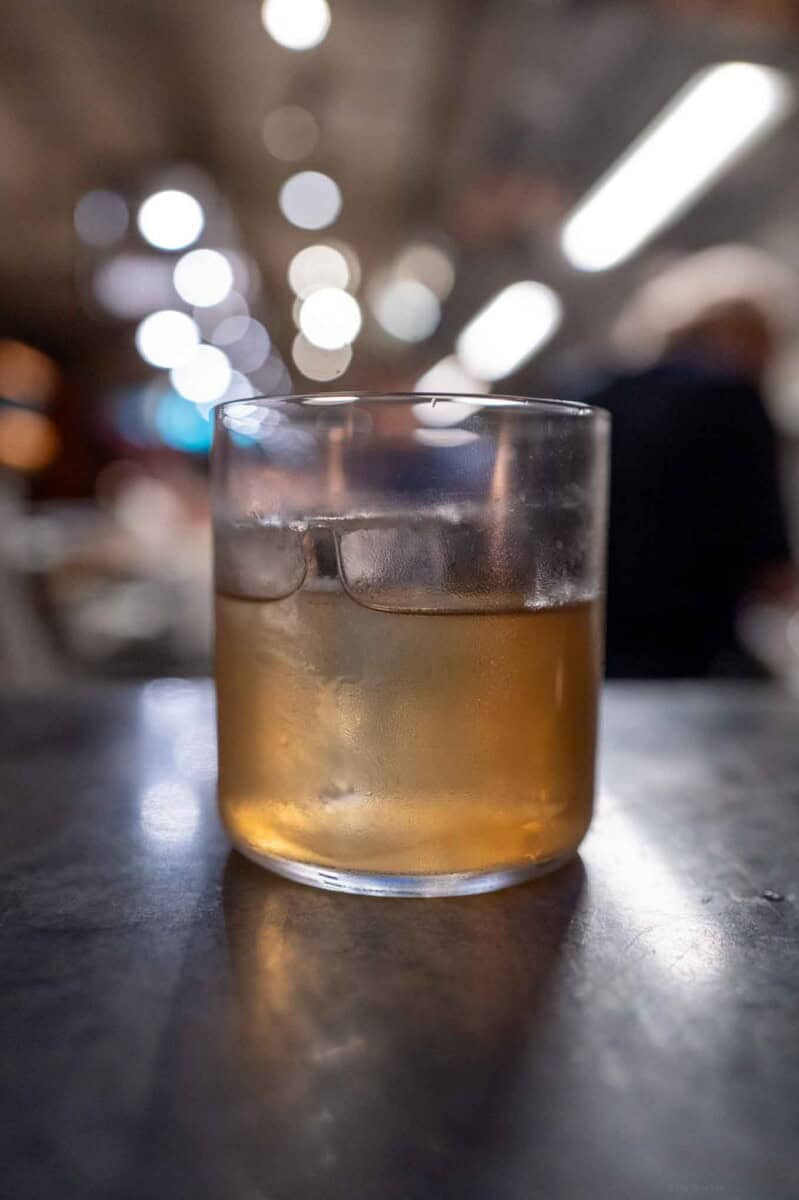 Whiskey served in a clear glass with ice cubes, perfect for a relaxing evening.